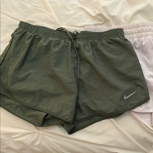 green nike shorts